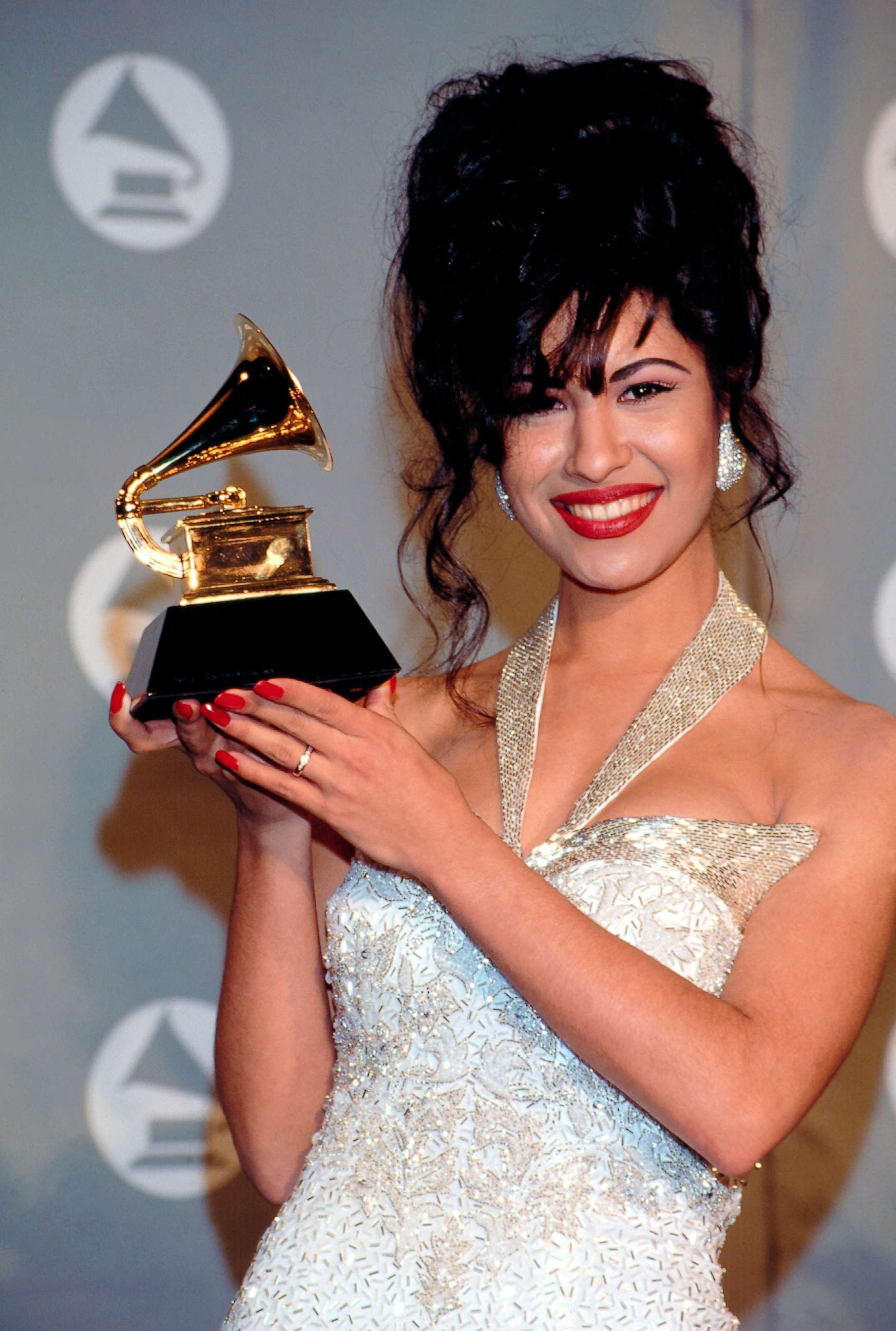 PHOTO: Selena Quintanilla-Perez poses with her award for Best Mexican-American Album in the pressroom of the 36th Annual Grammy Awards in New York, March 2, 1994.