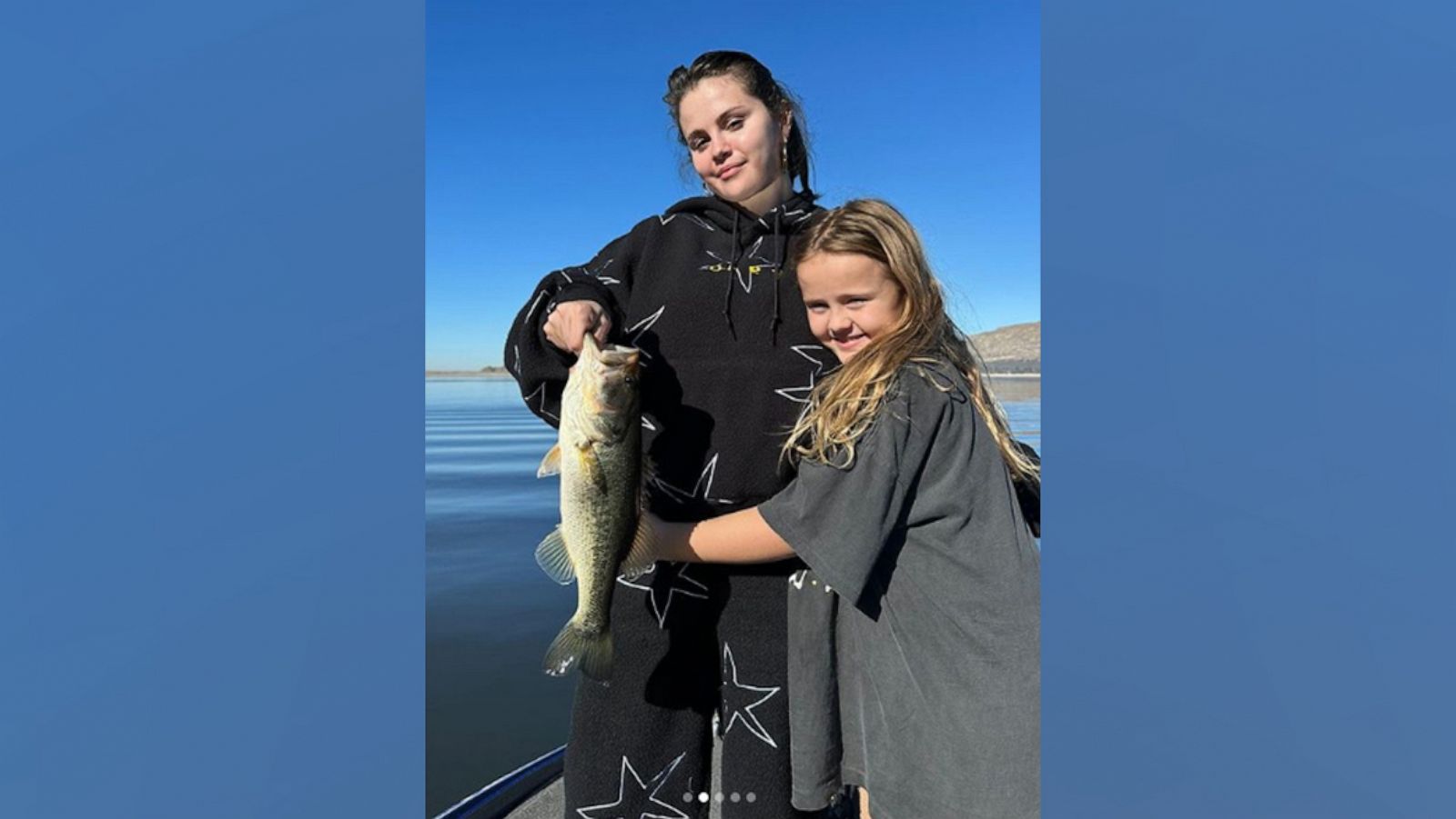 PHOTO: Selena Gomez and her sister Gracie pictured on a family fishing trip in a photo shared to Gomez's Instagram.