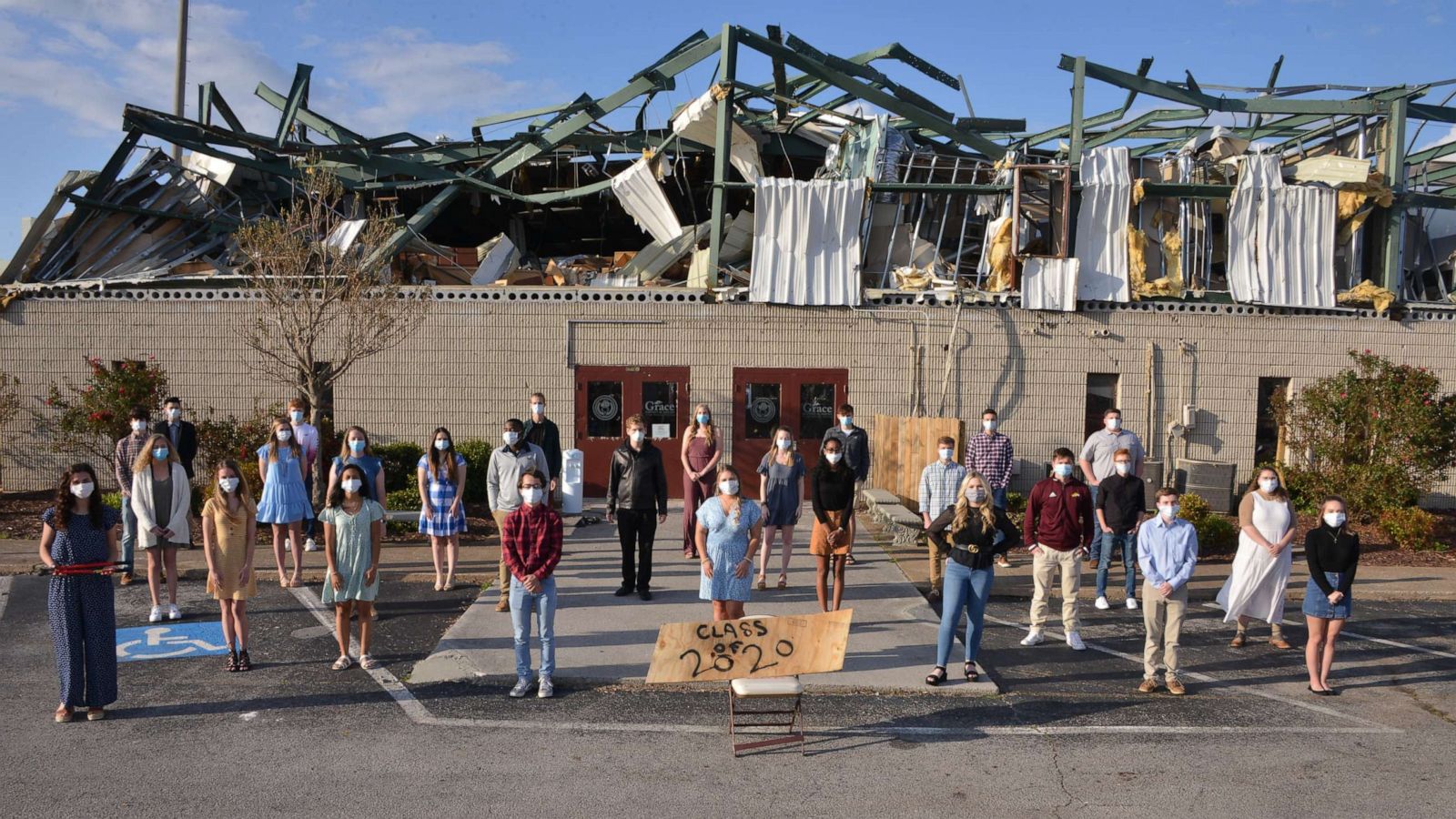 PHOTO: The Grace Baptist Academy high school seniors pose in front of their school that was destroyed by an Easter tornado on May 6, 2020 in Chattanooga, Tenn.