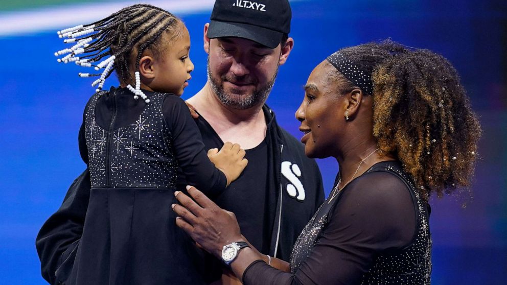 PHOTO: Serena Williams talks with her daughter Olympia and husband Alexis Ohanian after playing a match during the first round of the U.S. Open tennis championships, Aug. 29, 2022, in New York.