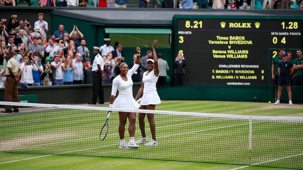 PHOTO: Venus Williams and Serena Williams celebrate victory in the Ladies Doubles Final against Timea Babos and Yaroslava Shvedova at the All England Lawn Tennis and Croquet Club on July 9, 2016 in London, England.