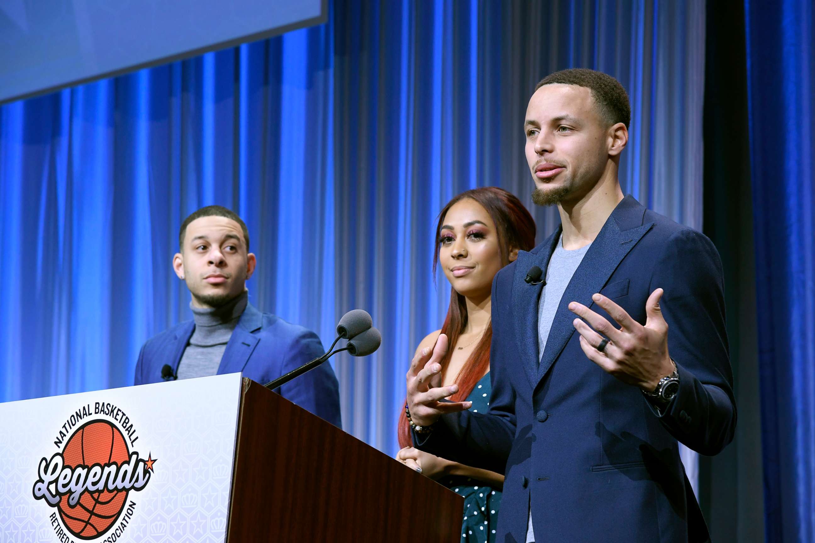 PHOTO: Seth and Sydel Curry listen as their brother Steph Curry gets ready to present the Home Town Hero award to their father Dell Curry at the Renaissance Charlotte Suites Hotel, Feb. 16, 2019, in Charlotte, North Carolina.