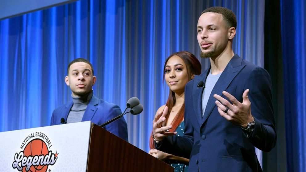 PHOTO: Seth and Sydel Curry listen as their brother Steph Curry gets ready to present the Home Town Hero award to their father Dell Curry at the Renaissance Charlotte Suites Hotel, Feb. 16, 2019, in Charlotte, North Carolina.