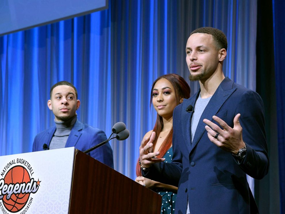 PHOTO: Seth and Sydel Curry listen as their brother Steph Curry gets ready to present the Home Town Hero award to their father Dell Curry at the Renaissance Charlotte Suites Hotel, Feb. 16, 2019, in Charlotte, North Carolina.