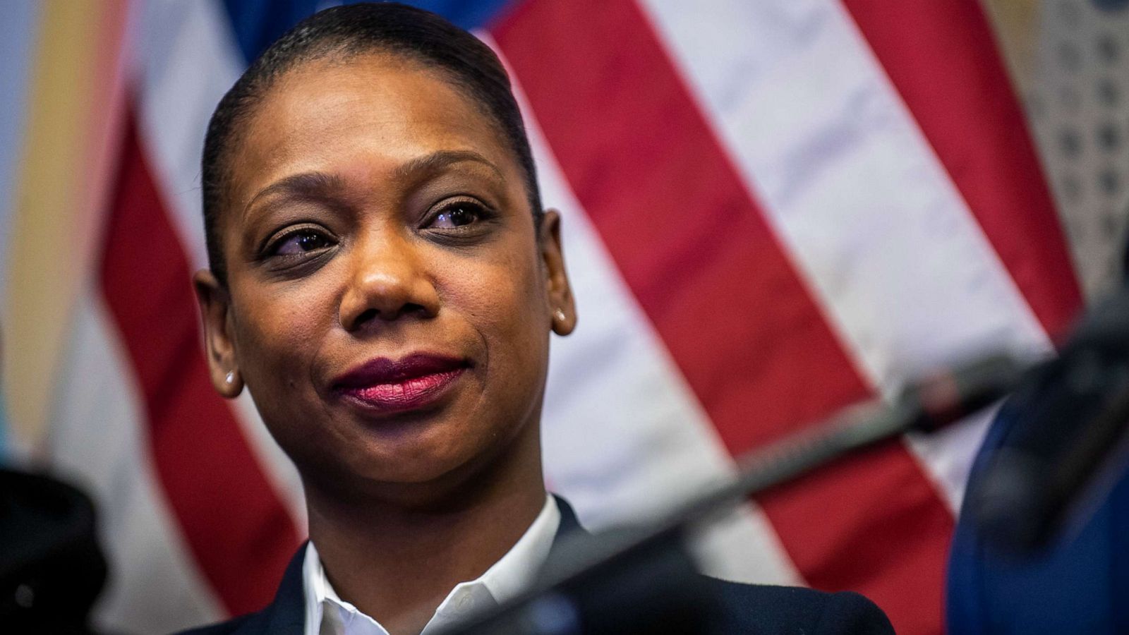 PHOTO: Keechant Sewell, the first black female NYPD commissioner, listens to Mayor-elect Eric Adams speak at the Queensbridge houses, Dec. 15, 2021, in New York.