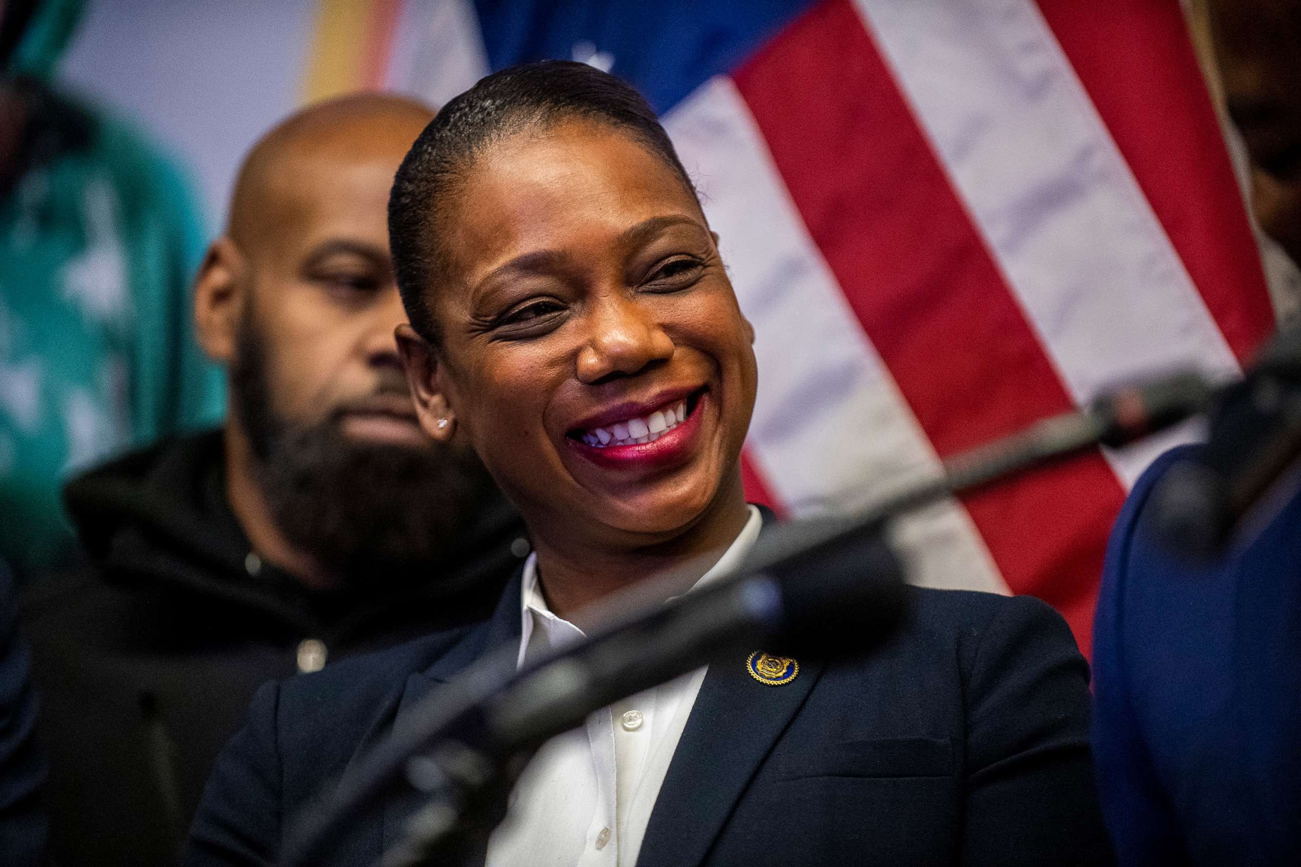 PHOTO: Keechant Sewell, the first black female NYPD commissioner, listens to Mayor-elect Eric Adams speak at the Queensbridge houses, Dec. 15, 2021, in New York.