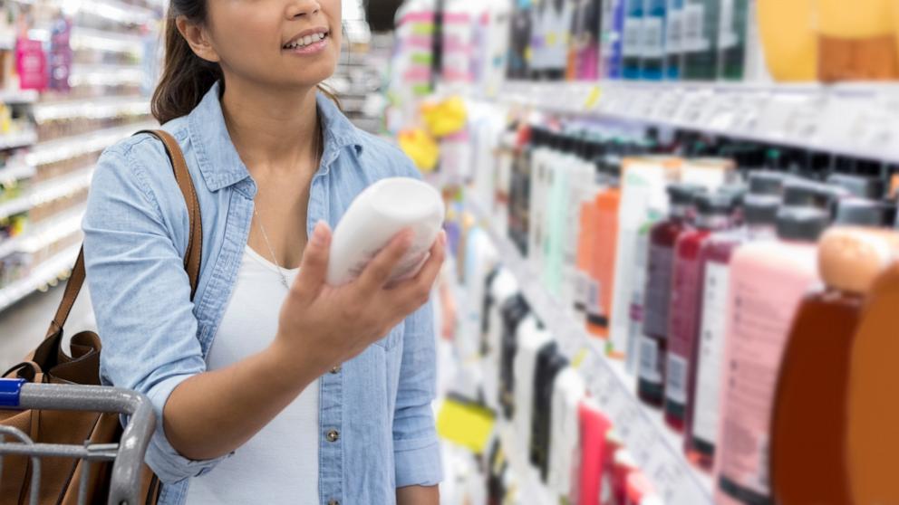 PHOTO: A woman shops for shampoo in an undated stock photo. 