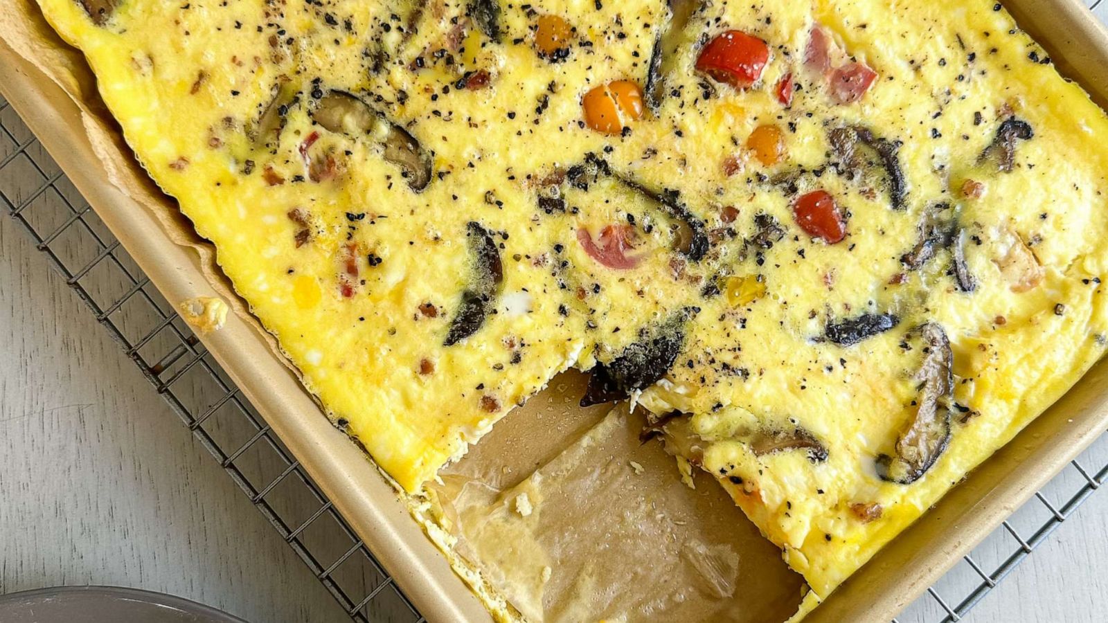 PHOTO: A tray of sheet pan scrambled eggs with vegetables.