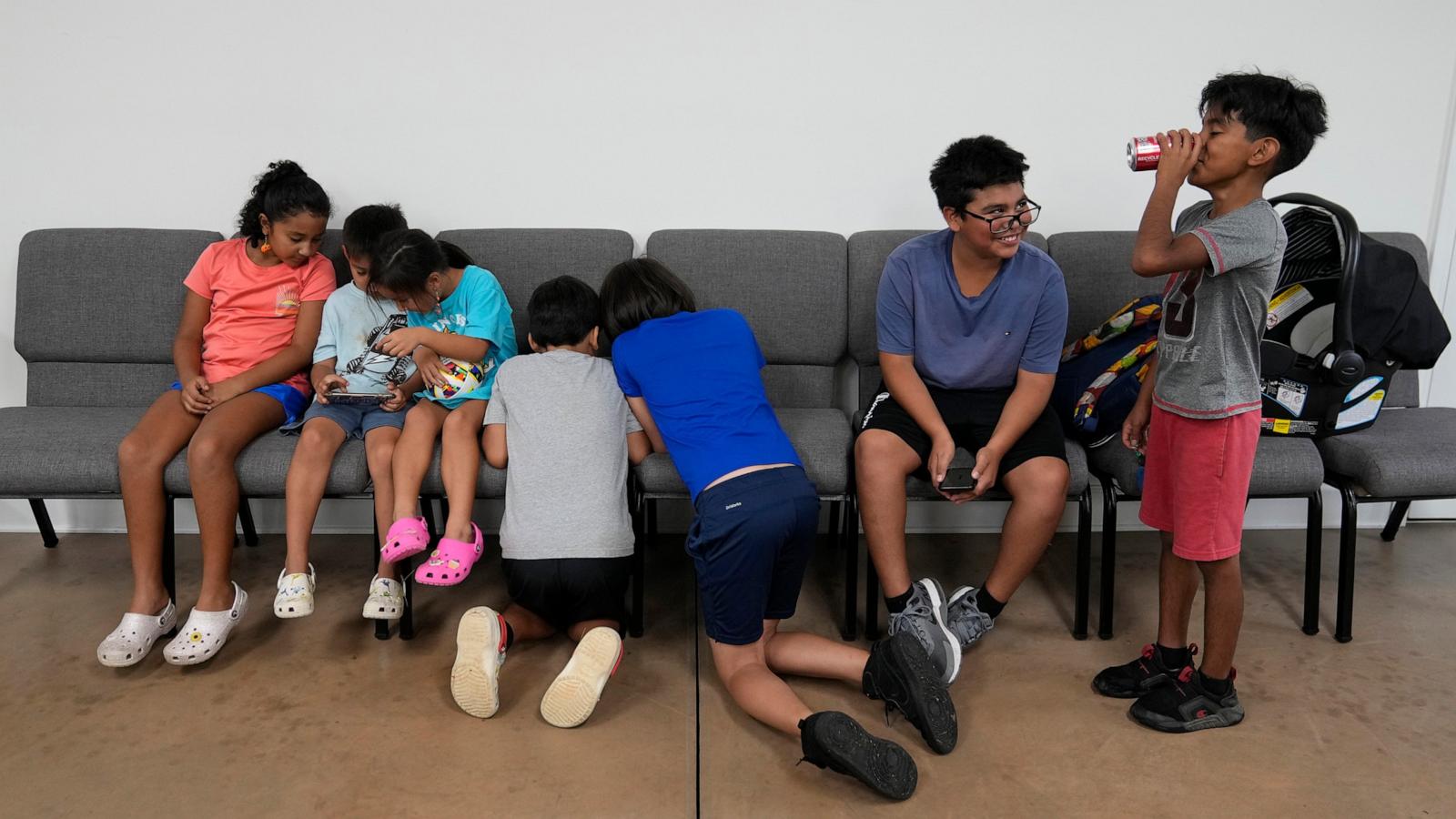 PHOTO: Children talk and play games inside St. Michael the Archangel Catholic church in the aftermath of Hurricane Helene, Oct. 4, 2024, in Erwin, Tenn.