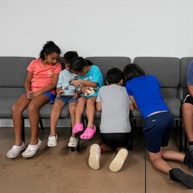 PHOTO: Children talk and play games inside St. Michael the Archangel Catholic church in the aftermath of Hurricane Helene, Oct. 4, 2024, in Erwin, Tenn. 