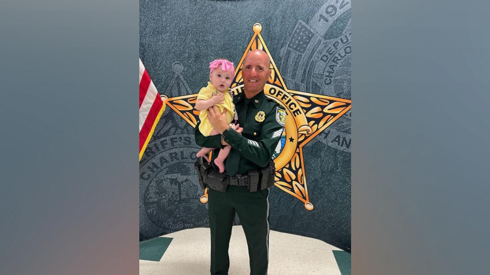 PHOTO: Sgt. David Musgrove, of the Charlotte County Sheriff's Office, holds Lola, a 6-month-old infant whose life he saved after a car crash.