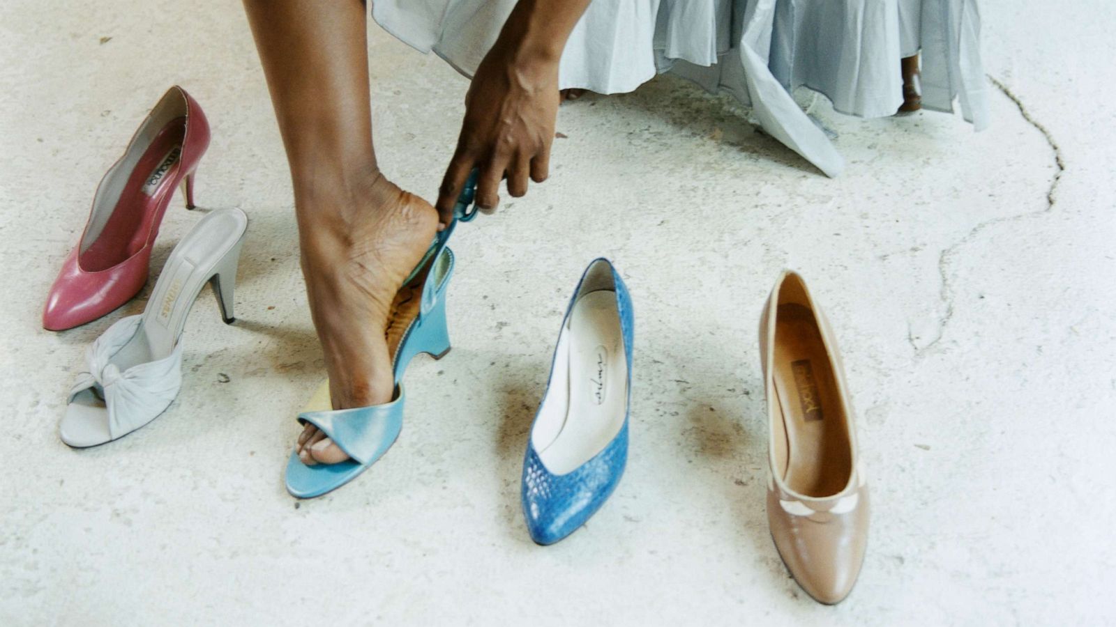 PHOTO: Woman trying on shoes in a shoe store.