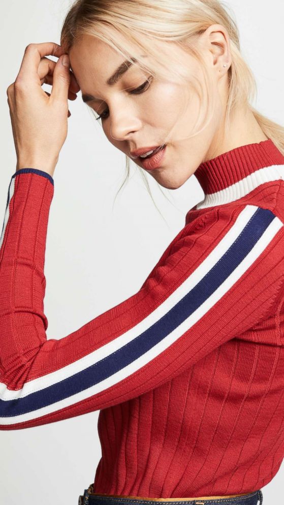 PHOTO: When your day is a race to the finish line, slip on the trim sweater that has a friendly competitive edge. Style Hint: We love to see it with skinny skirts to keep the look lean, or wide trousers to play with proportions.