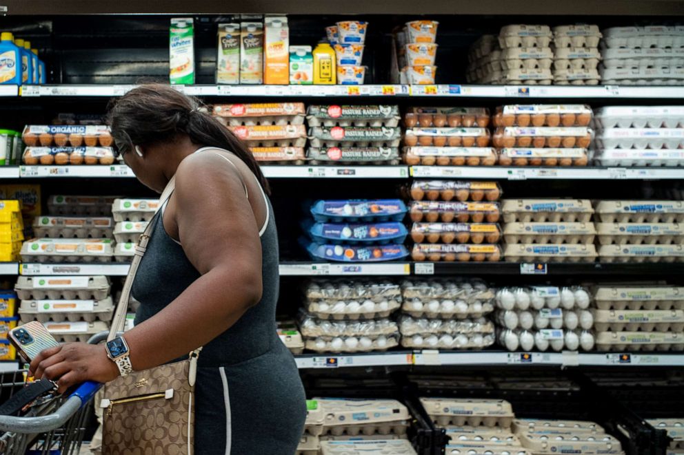 PHOTO: A customer shops for eggs in a Kroger grocery store, Aug.15, 2022, in Houston. 