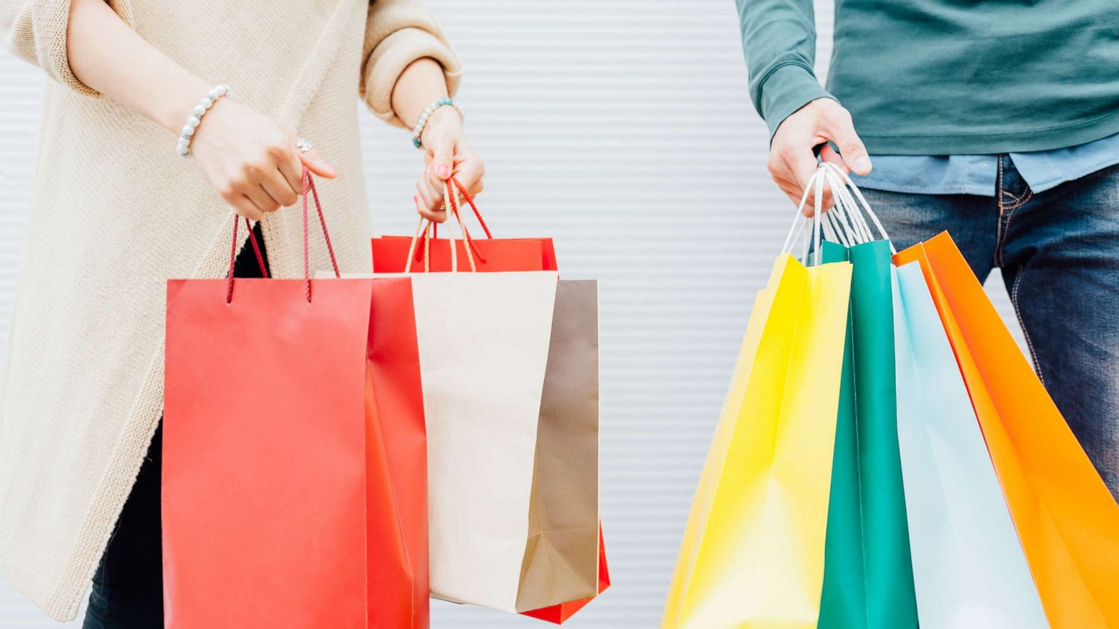 PHOTO: A young couple holds shopping bags in this undated stock photo.