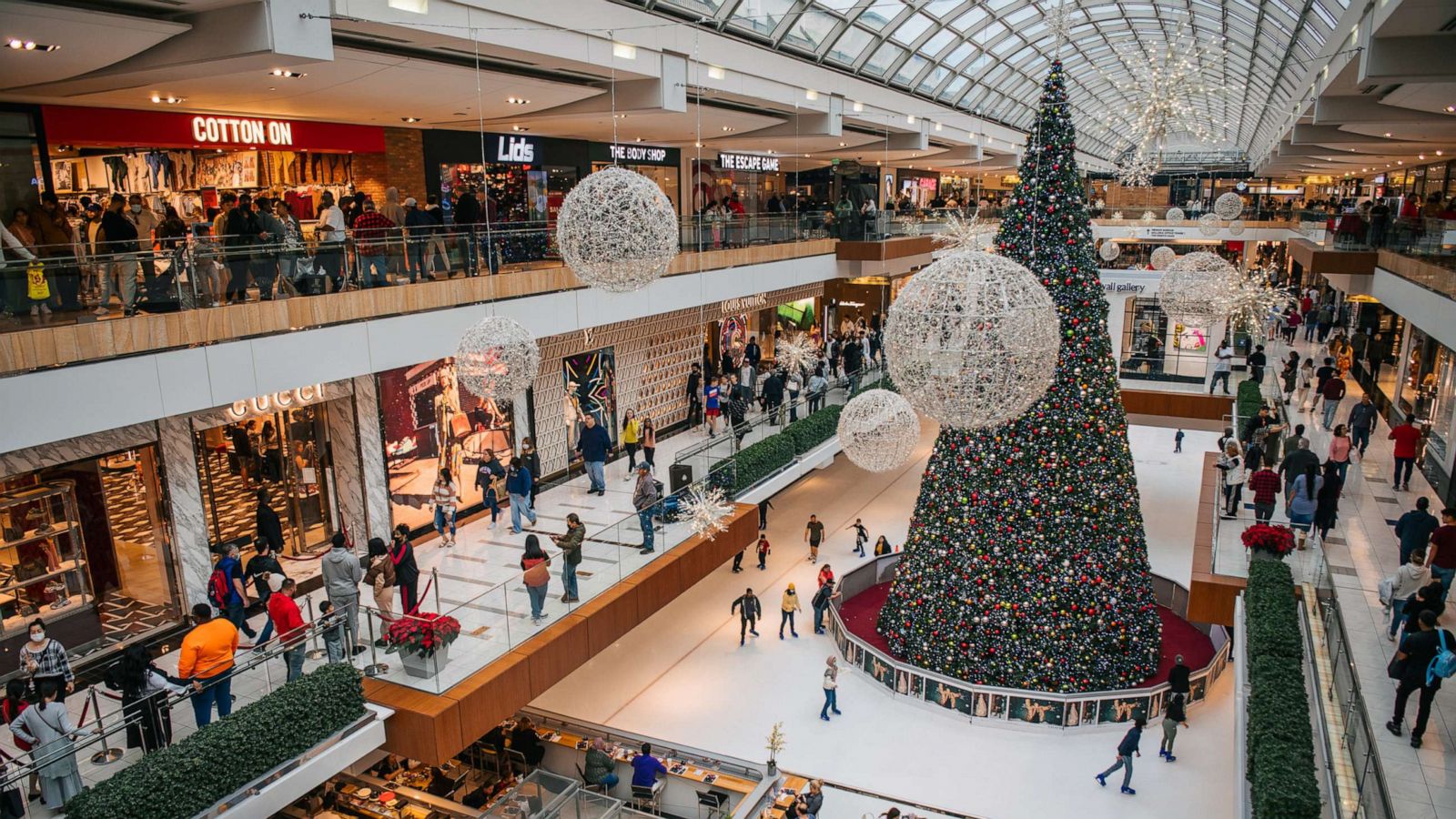 PHOTO: In this Nov. 26, 2021, file photo, people shop in The Galleria mall in Houston.