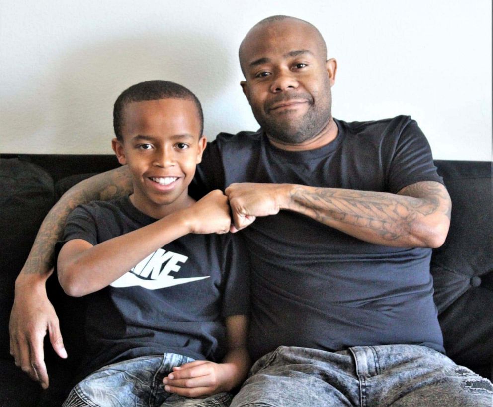 PHOTO: Father-son duo, Shyon and Johnnie Clark, give each other a fist bump in this undated family photo.