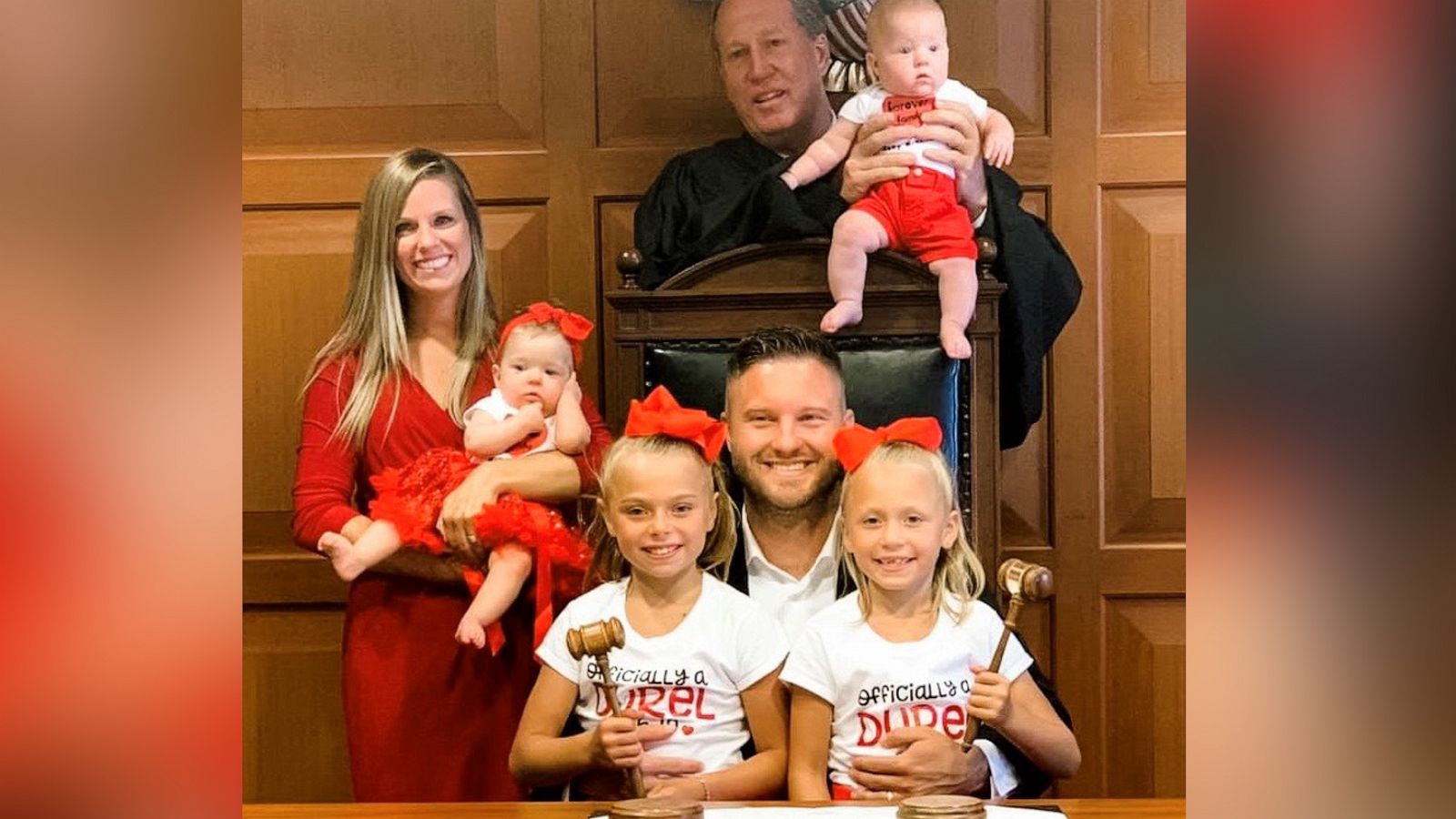 PHOTO: BJ Durel, seated, and Calena Durel, far left, celebrate the adoption of Maria and Aubree, seated.