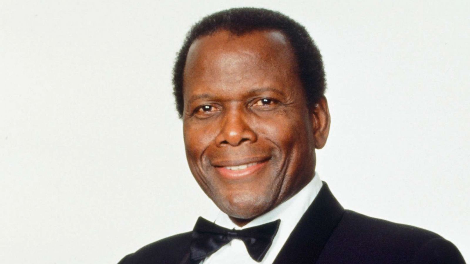 PHOTO: Actor Sidney Poitier poses for a portrait with his AFI Lifetime Achievement Award, March 12, 1992.