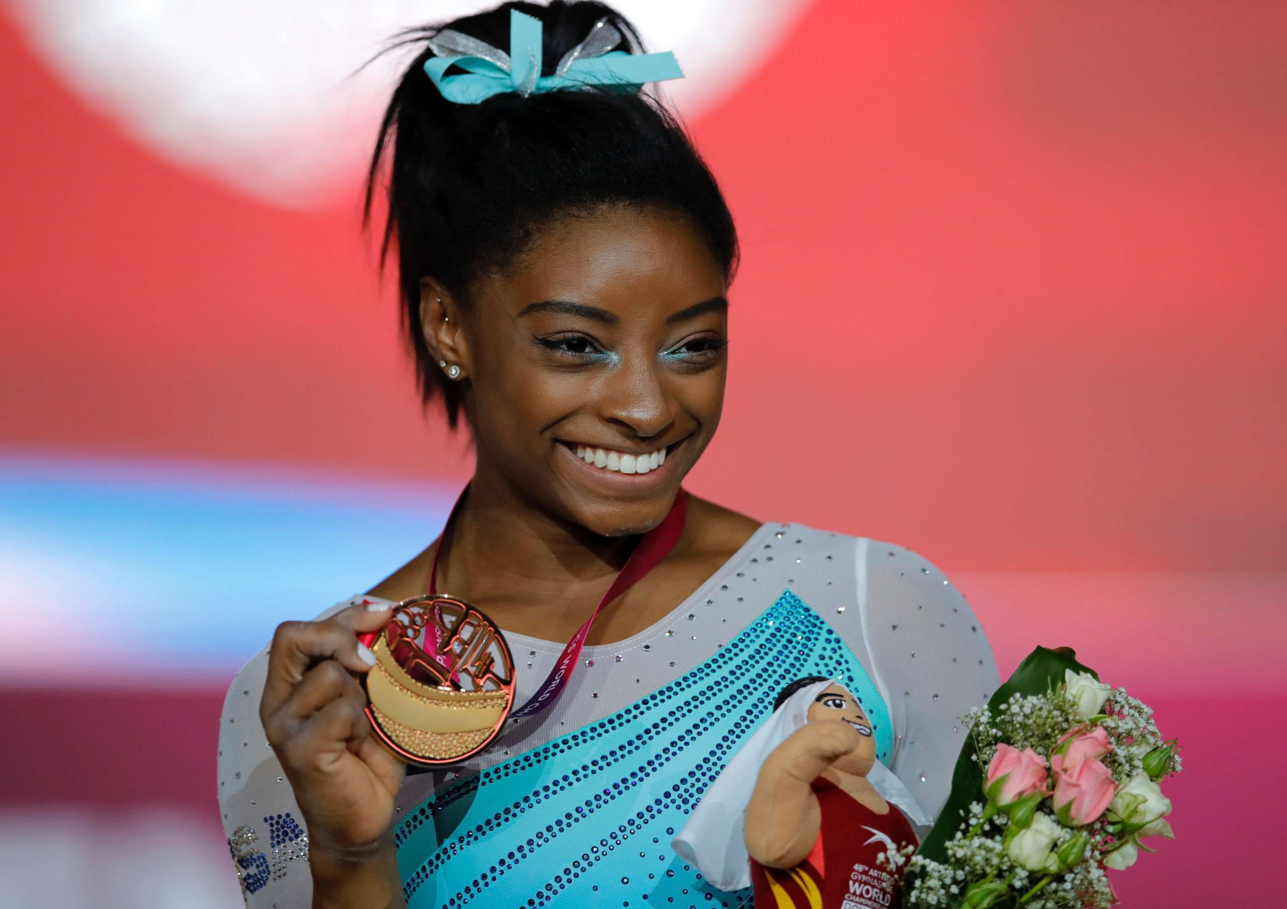 PHOTO: Gold medallist and four-times all-around world champion Simone Biles, of the U.S., poses on the podium after the women's all-around final of the Gymnastics World Chamionships at the Aspire Dome in Doha, Qatar, Nov. 1, 2018.