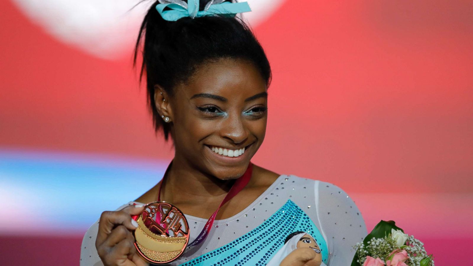 PHOTO: Gold medallist and four-times all-around world champion Simone Biles, of the U.S., poses on the podium after the women's all-around final of the Gymnastics World Chamionships at the Aspire Dome in Doha, Qatar, Nov. 1, 2018.