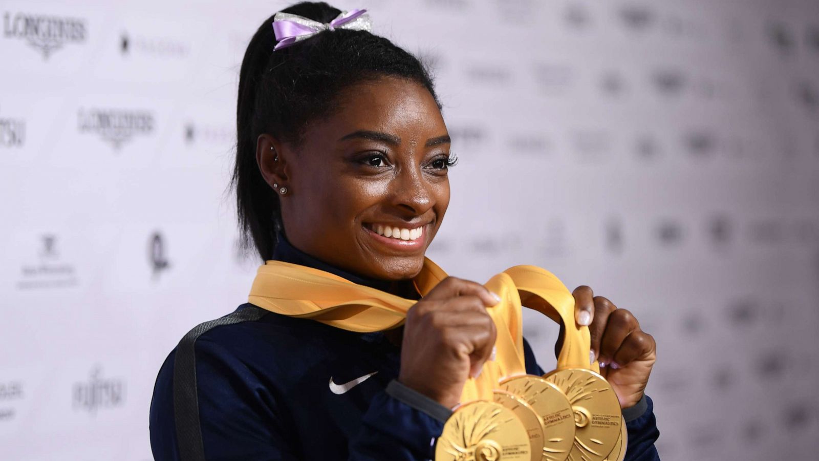 PHOTO: Simone Biles poses with her medals at the FIG Artistic Gymnastics World Championships at Hanns Martin Schleyer Hall on Oct. 13, 2019, in Stuttgart, Germany.