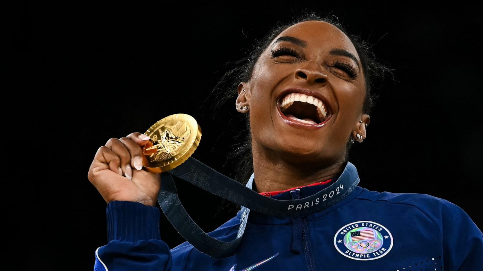 PHOTO: Simone Biles celebrates with her gold medal during the podium ceremonny after the artistic gymnastics women's vault final during the Paris 2024 Olympic Games at the Bercy Arena in Paris, on August 3, 2024.