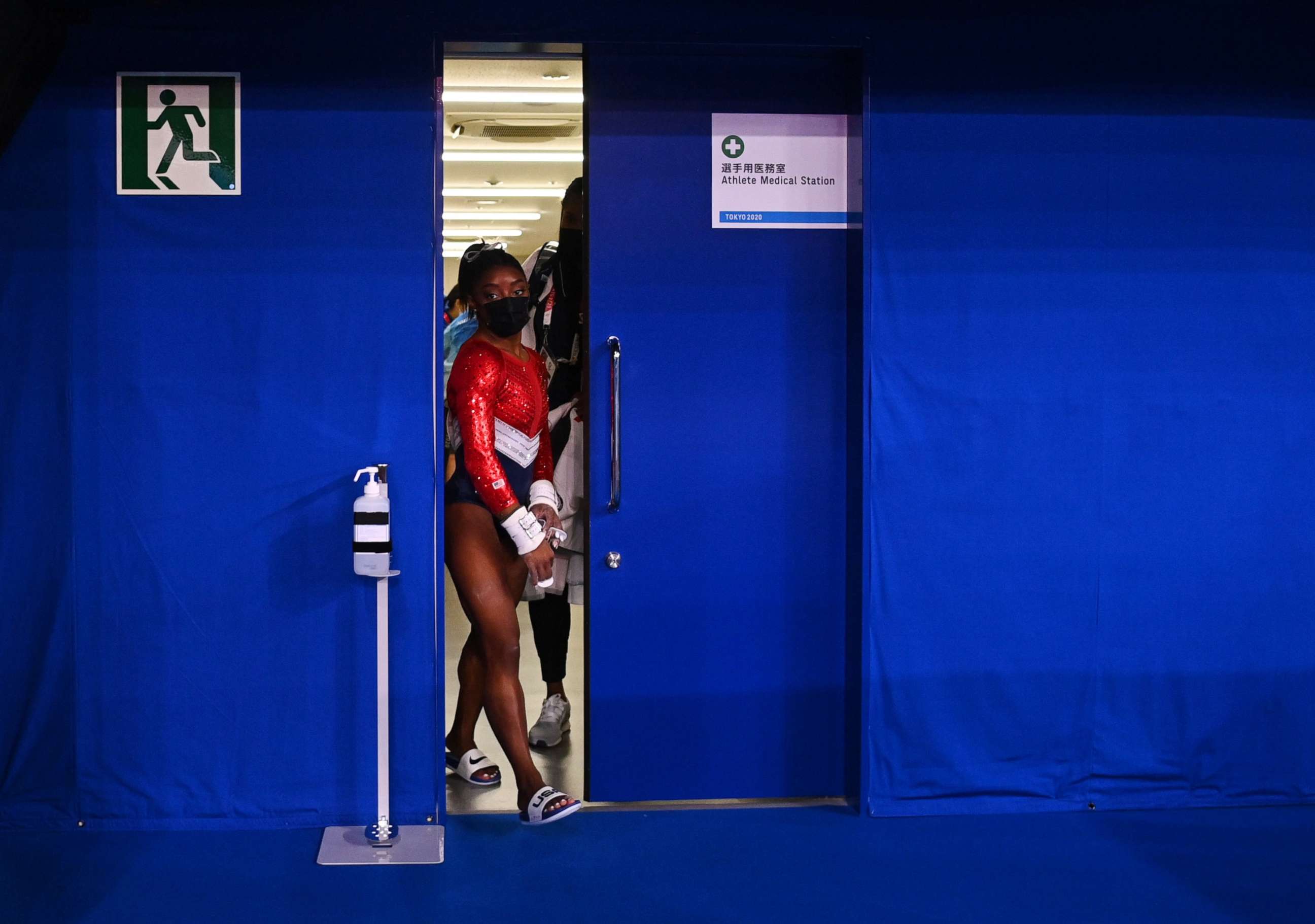 PHOTO: Simone Biles of the United States leaves a medical station during the women's gymnastics team final, July 27, 2021, at the 2020 Summer Olympics in Tokyo.