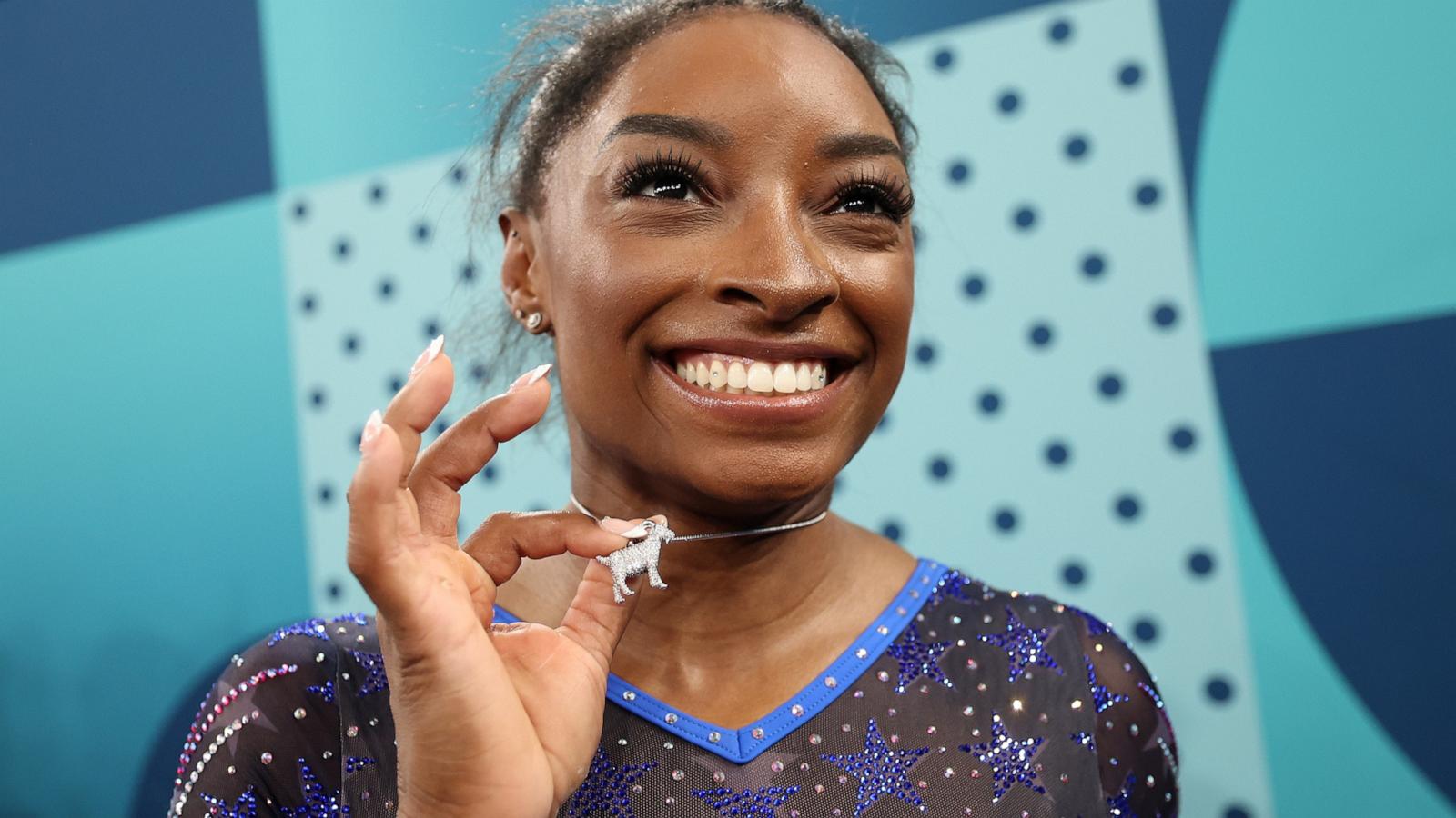 PHOTO: Gold medalist Simone Biles of Team USA poses with a necklace in the likeness of a goat after competing in the Artistic Gymnastics Women's All-Around Final on day six of the Olympic Games Paris 2024, Aug. 1, 2024, in Paris.