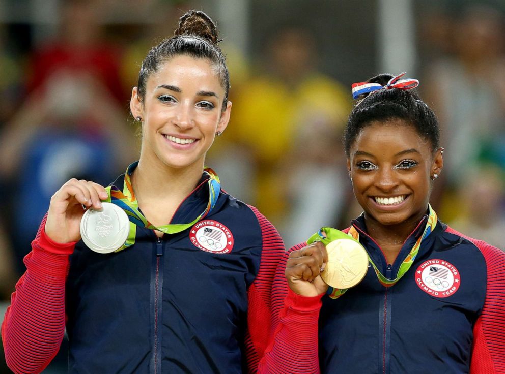 PHOTO: Alexandra Raisman, left, and Simone Biles of the U.S. pose for photographs on the podium at the medal ceremony for the Women's Floor on Day 11 of the Rio 2016 Olympic Games at the Rio Olympic Arena on Aug. 16, 2016 in Rio de Janeiro.