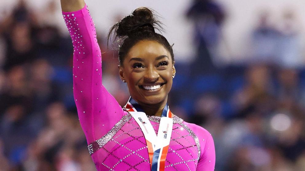 PHOTO: Simone Biles celebrates after taking first place in the floor routine during the 2024 Core Hydration Classic at XL Center on May 18, 2024 in Hartford, Conn. 