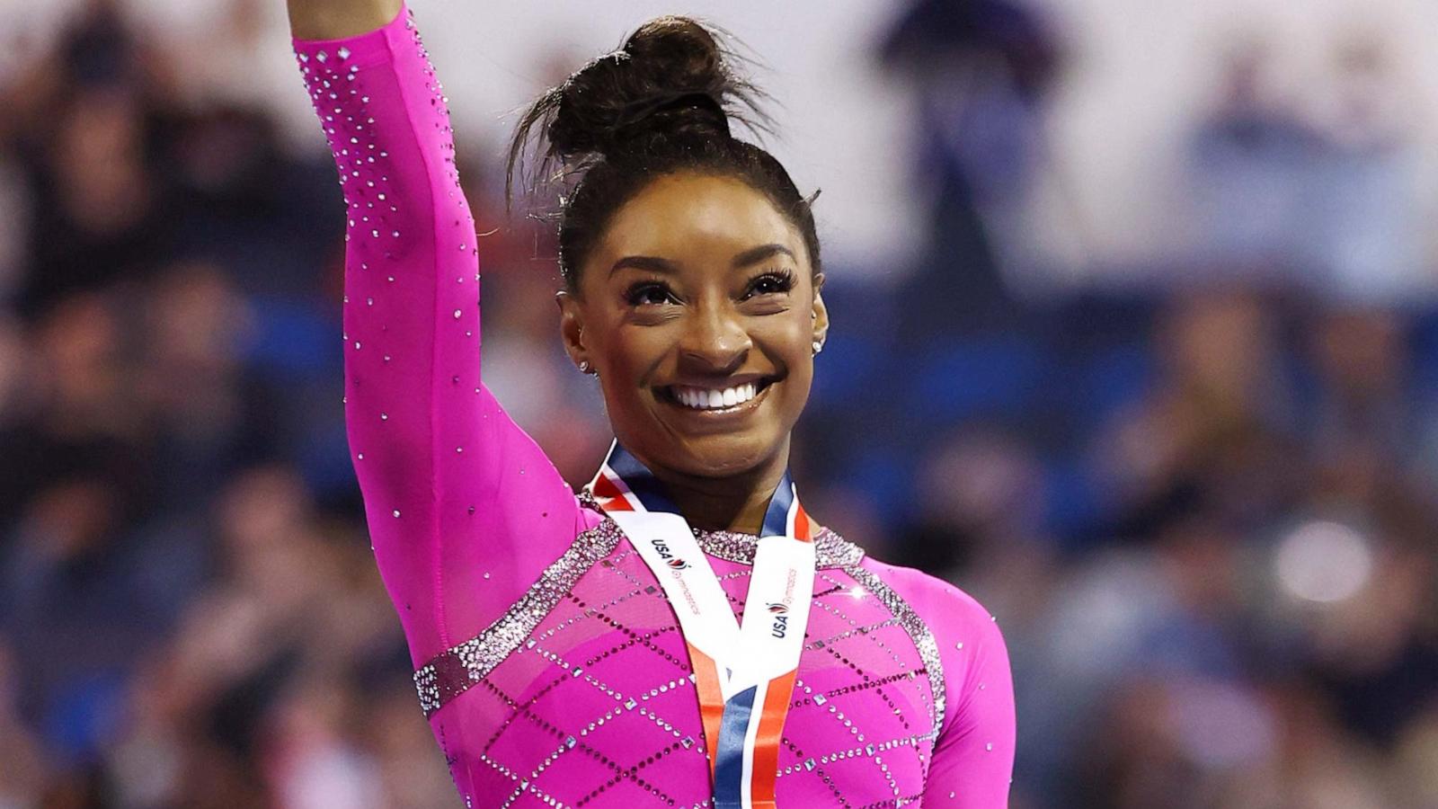 PHOTO: Simone Biles celebrates after taking first place in the floor routine during the 2024 Core Hydration Classic at XL Center on May 18, 2024 in Hartford, Conn.