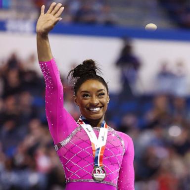 PHOTO: Simone Biles celebrates after taking first place in the floor routine during the 2024 Core Hydration Classic at XL Center on May 18, 2024 in Hartford, Conn. 