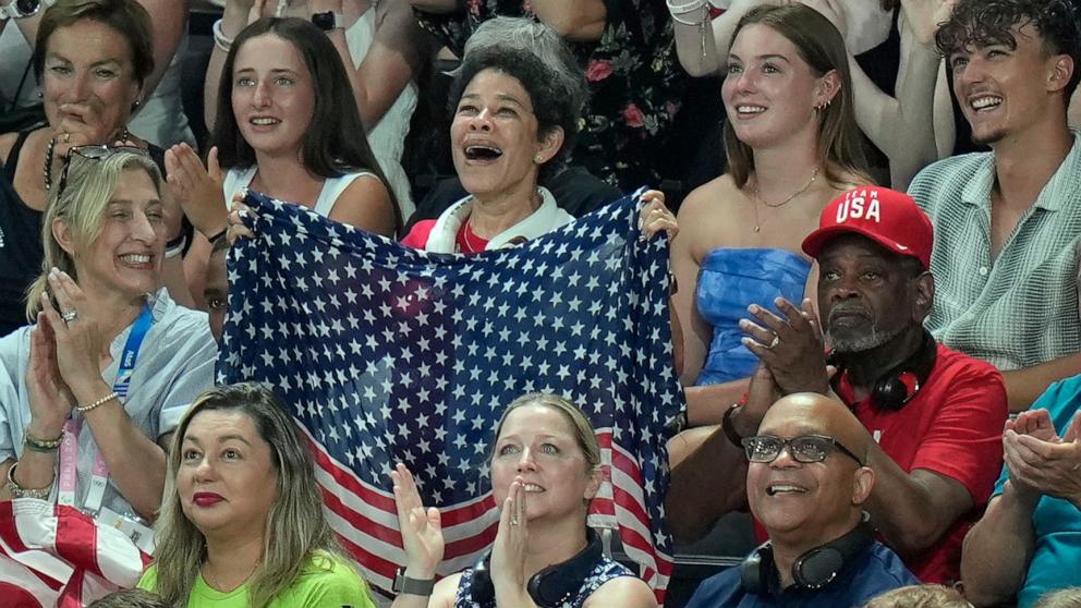 PHOTO: Simone Biles' mother Nellie Biles cheers as her daughter is introduced during the women's artistic gymnastics team finals round at Bercy Arena at the 2024 Summer Olympics, on July 30, 2024, in Paris.