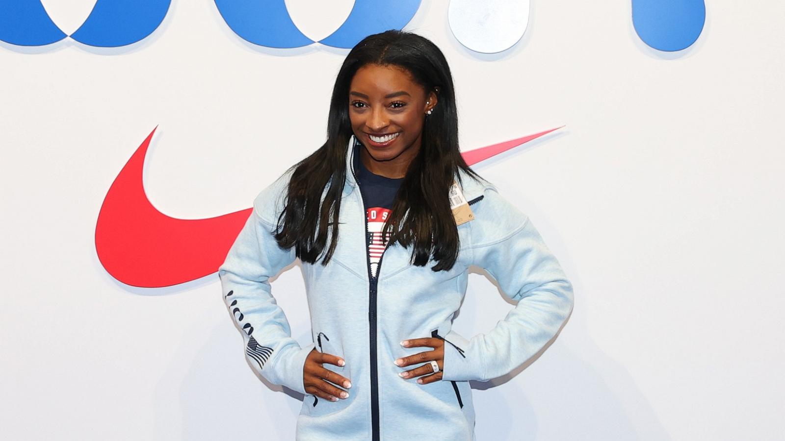 PHOTO: Simone Biles tries on clothes at the Team USA Welcome Experience Ahead of Paris 2024, July 22, 2024, in Paris.