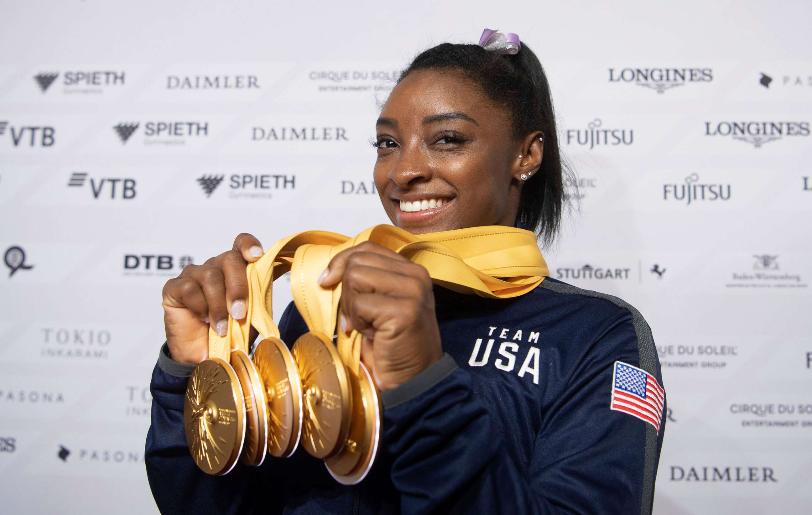 PHOTO: Simone Biles of the United States shows her five gold medals at the Gymnastics World Championships in Stuttgart, Germany, Oct. 13, 2019.