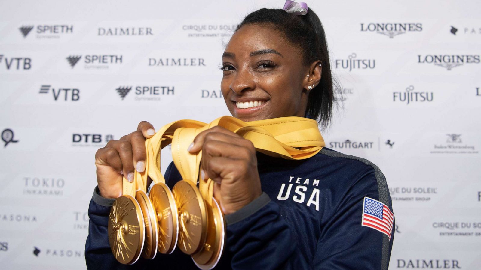 PHOTO: Simone Biles of the United States shows her five gold medals at the Gymnastics World Championships in Stuttgart, Germany, Oct. 13, 2019.