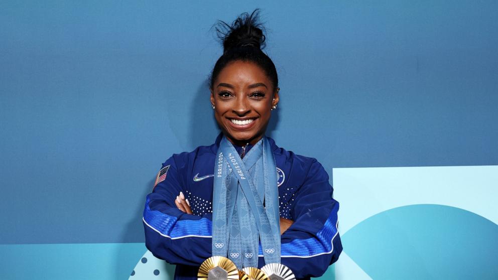 PHOTO: Simone Biles of Team United States poses with her Paris 2024 Olympic medals following the Artistic Gymnastics Women's Floor Exercise Final on day ten of the Olympic Games Paris 2024 at Bercy Arena on August 05, 2024 in Paris, France.