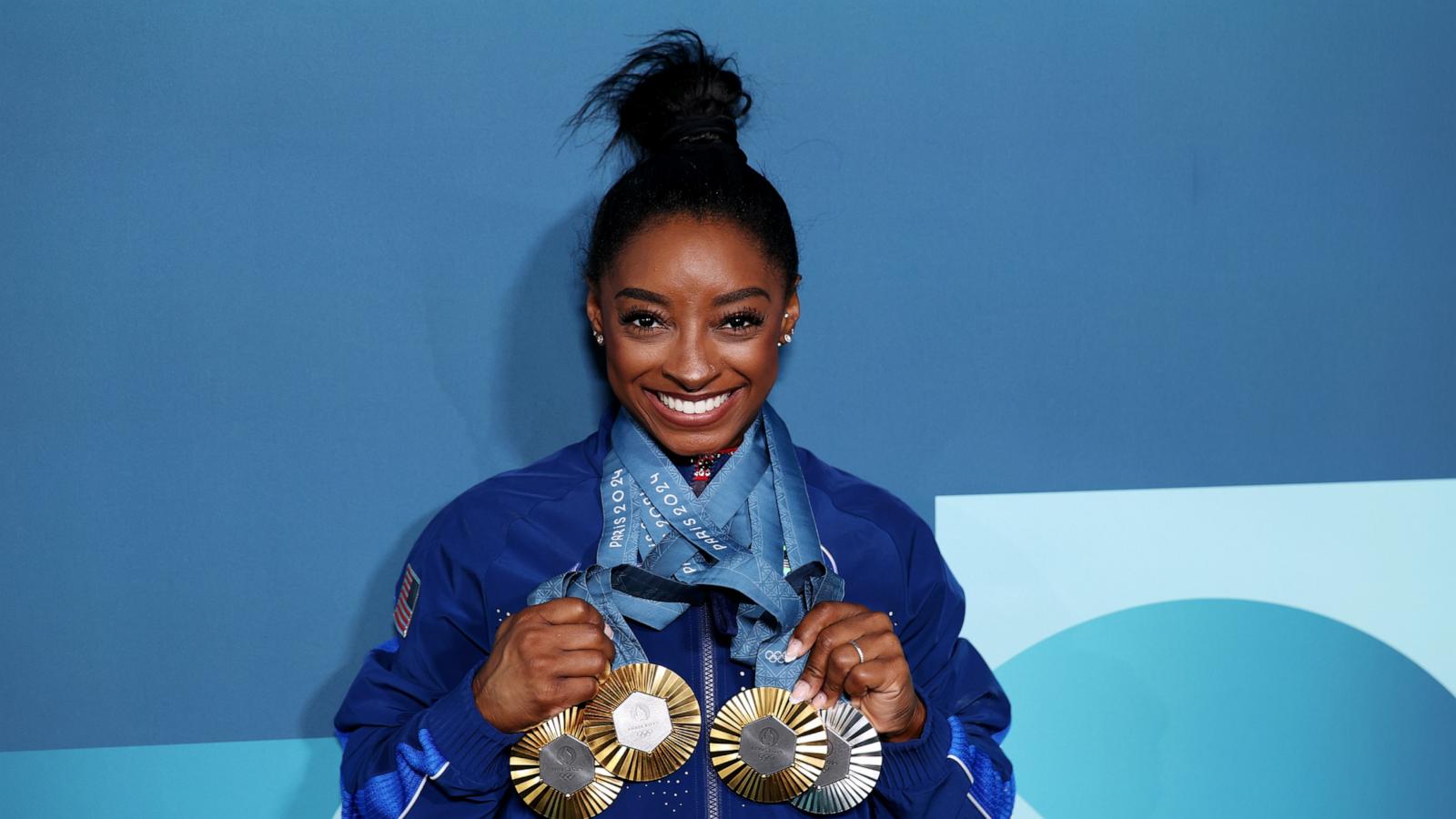 PHOTO: Simone Biles of Team poses with her Paris 2024 Olympic medals following the Artistic Gymnastics Women's Floor Exercise Final on day ten of the Olympic Games Paris 2024 at Bercy Arena on Aug. 5, 2024 in Paris.