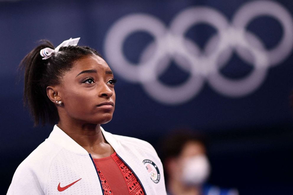 PHOTO: Simone Biles looks on during the artistic gymnastics women's team final during the Tokyo 2020 Olympic Games in Tokyo, July 27, 2021.
