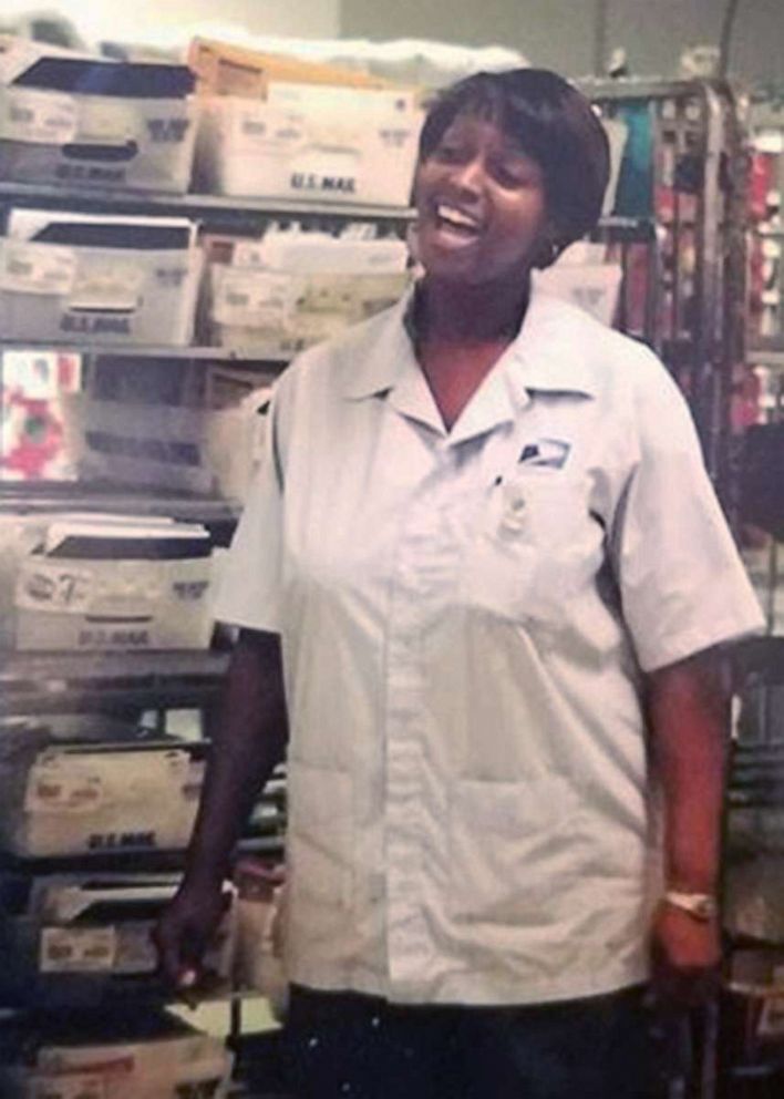 PHOTO: Stephanie Hayes-Bostic singing while working as a letter carrier.