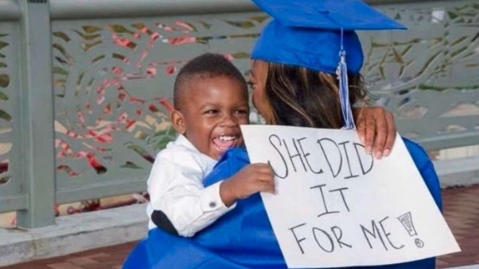 PHOTO: Soncya Williams of Nashville, Tennessee, is wearing her cap and gown and embracing her little boy Elijah, who is holding a sign which reads "She did it for me!" in a photo that was snapped in 2014.