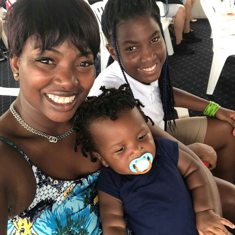 PHOTO: Sherina Akins of Miami officially adopted Christyana, 10, and Isaiah, 1, at Miami Dade Children Juvenile Courthouse. Both children are her biological cousins.