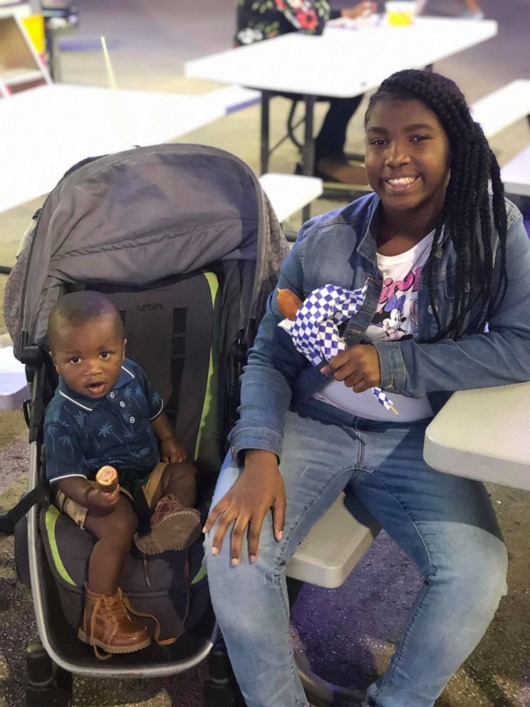 PHOTO: Sherina Akins of Miami officially adopted Christyana, 10, and Isaiah, 1, at Miami Dade Children Juvenile Courthouse. Both children are her biological cousins.