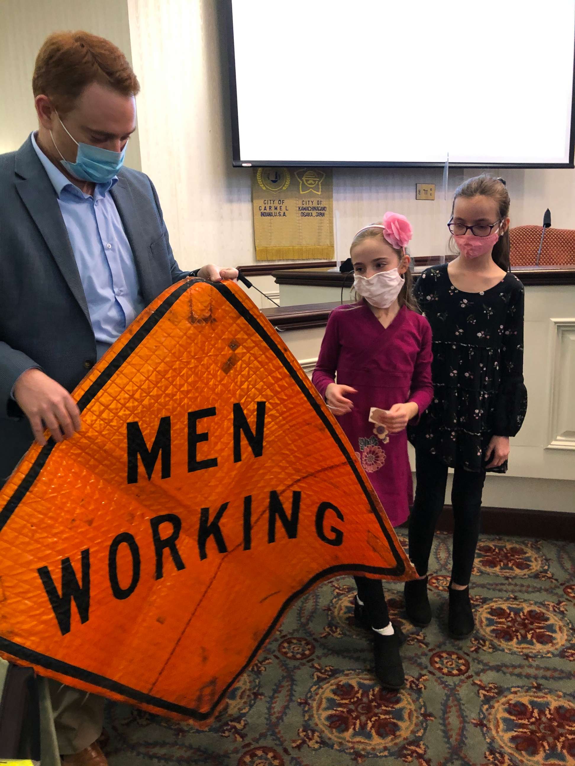 PHOTO: On March 1, the first day of Women's History Month, Blair and Brienne attended a City Hall council meeting in Carmel, Indiana, where they read their letters and received a "Men Working" sign that officials dug up from storage.