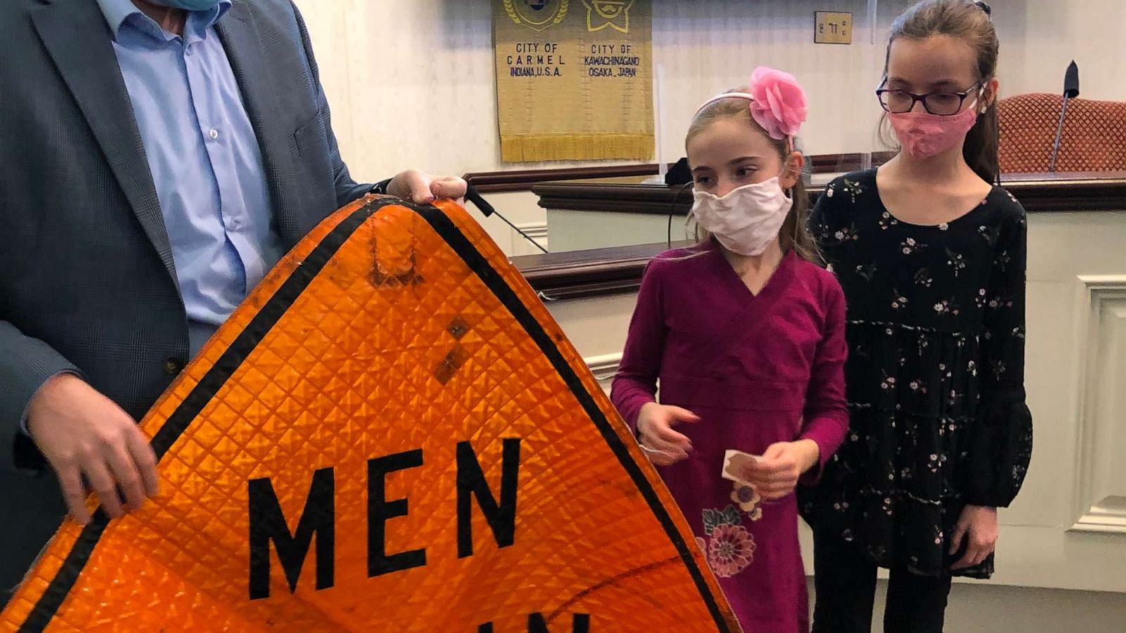 PHOTO: On March 1, the first day of Women's History Month, Blair and Brienne attended a City Hall council meeting in Carmel, Indiana, where they read their letters and received a "Men Working" sign that officials dug up from storage.