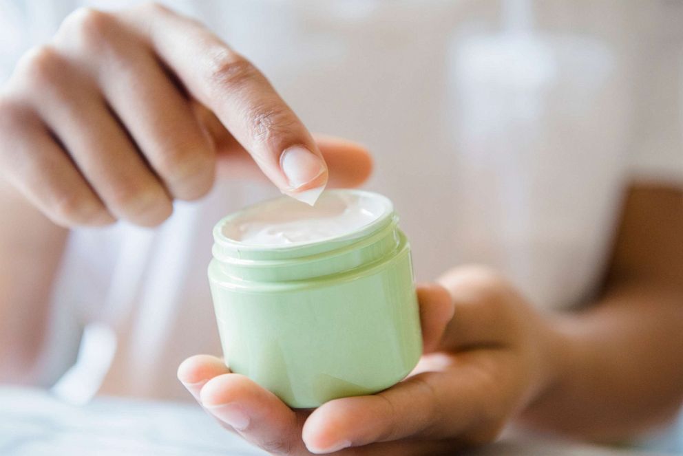 PHOTO: A woman is pictured dipping a finger in lotion jar in this undated stock photo.