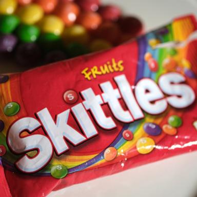 PHOTO: In this My 19, 2020, file photo, a package of Skittles, a fruit-flavored candy, produced by Wrigley Company, a division of Mars, Inc., is shown.