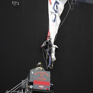 PHOTO: Blacksburg Volunteer Fire Department rescue a skydiver who crashed into the scoreboard at Lane Stadium in Blacksburg, VA on April 18, 2026.