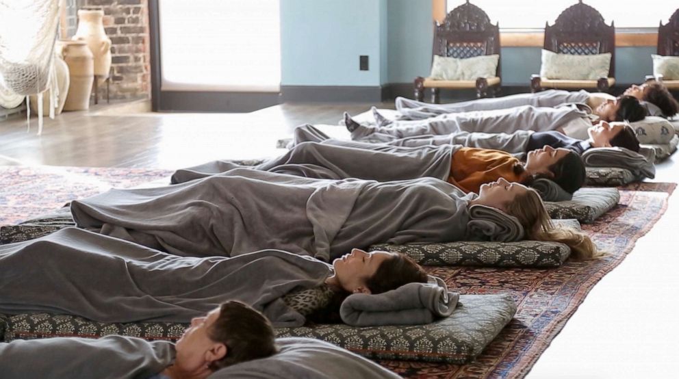 PHOTO: Students practice Yoga Nidra at The DEN Meditation in Los Angeles, California, on November 13, 2019.